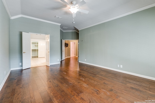 empty room featuring lofted ceiling, ceiling fan, crown molding, and wood-type flooring