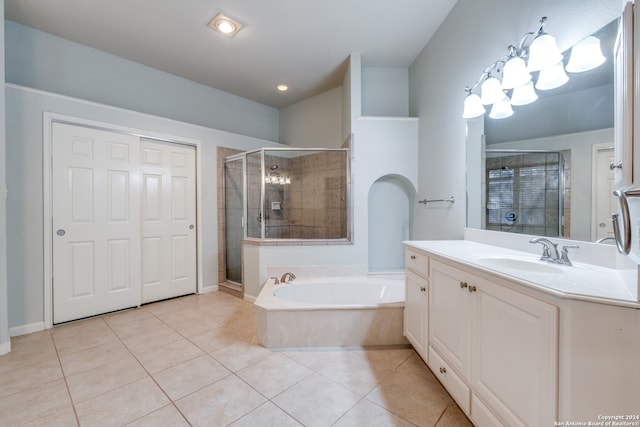 bathroom with vanity, tile patterned floors, and shower with separate bathtub