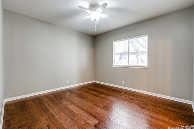 unfurnished room with ceiling fan and hardwood / wood-style flooring