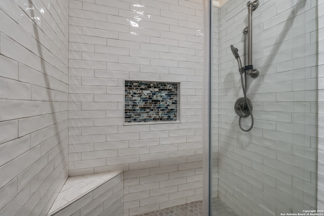 bathroom featuring tiled shower