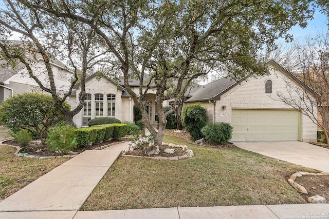 view of front of house featuring a garage and a front yard