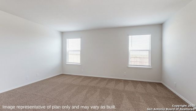 unfurnished room with carpet and a healthy amount of sunlight