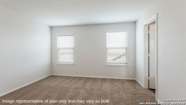 carpeted empty room featuring a healthy amount of sunlight