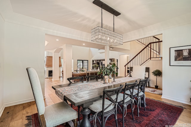 dining area featuring a chandelier and light hardwood / wood-style floors