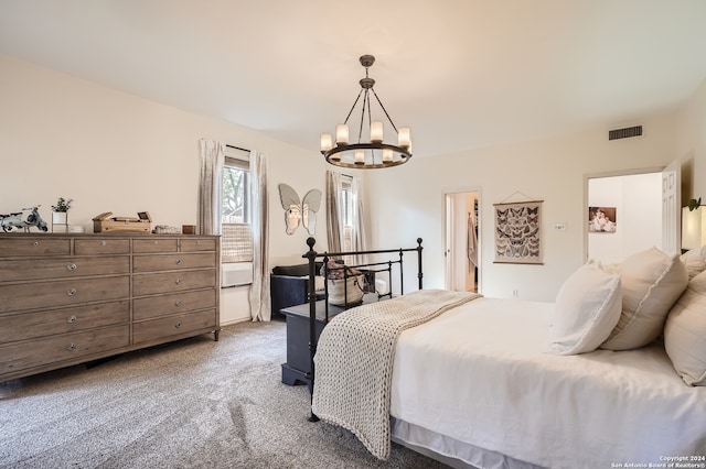 bedroom featuring carpet floors and a chandelier