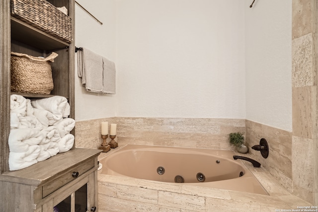 bathroom with tiled bath