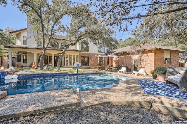 view of swimming pool with a patio