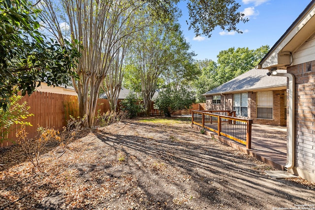 view of yard with a deck