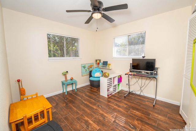 home office with dark hardwood / wood-style floors, a wealth of natural light, and ceiling fan