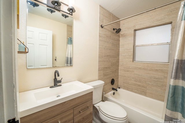 full bathroom with shower / tub combo, vanity, and toilet