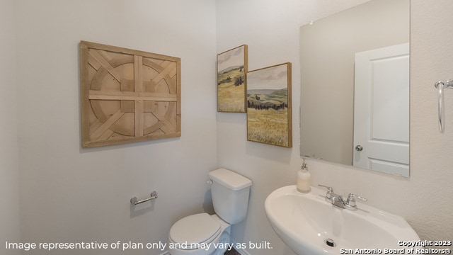 bathroom featuring toilet and a sink