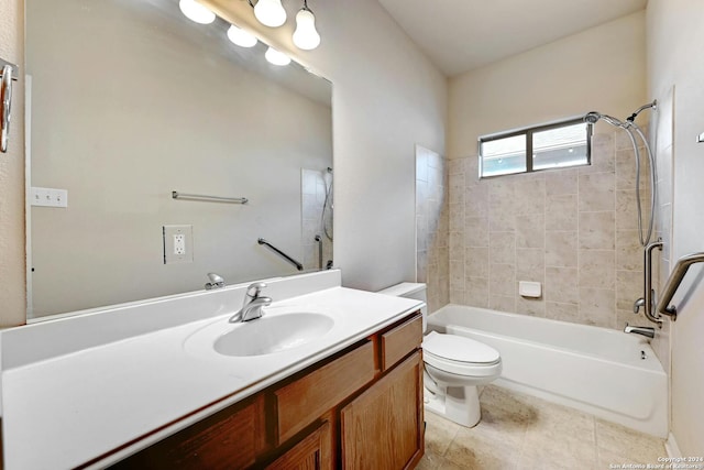 full bathroom featuring tile patterned flooring, tiled shower / bath, vanity, and toilet