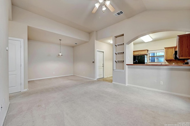 unfurnished living room with light carpet, lofted ceiling, and ceiling fan