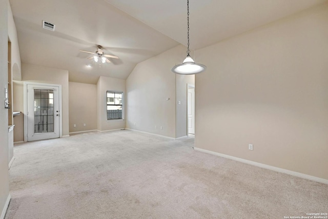 carpeted empty room featuring ceiling fan and lofted ceiling