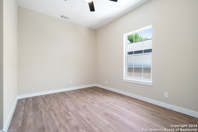 unfurnished room with light hardwood / wood-style floors and ceiling fan