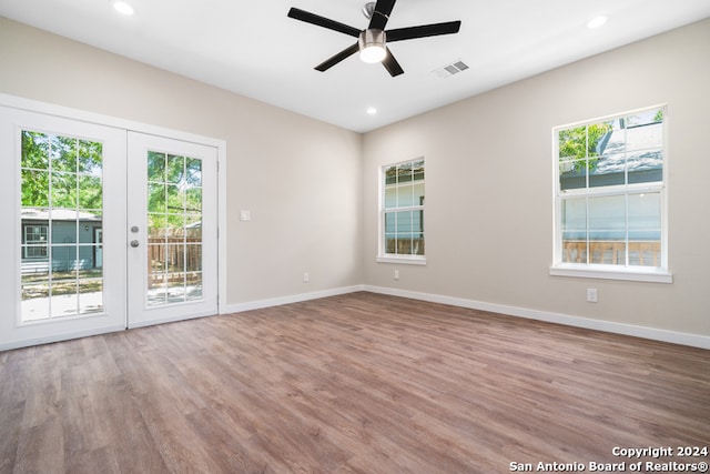 spare room with french doors, hardwood / wood-style flooring, and ceiling fan