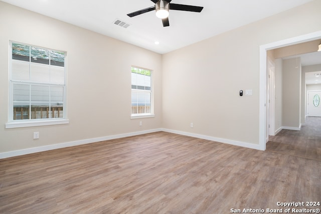 empty room featuring ceiling fan and light wood-type flooring