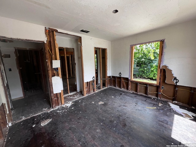 interior space featuring a textured ceiling