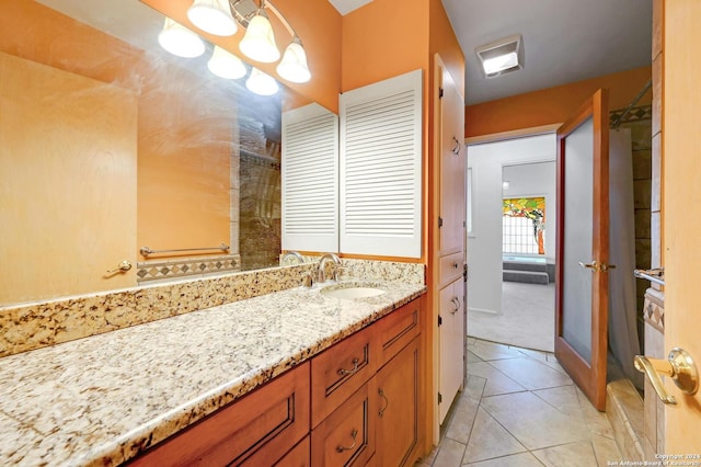 bathroom with tile patterned flooring and vanity