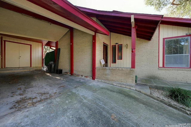 exterior space featuring a carport