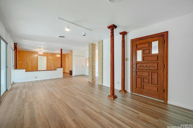 entrance foyer featuring ceiling fan, light hardwood / wood-style floors, ornate columns, and rail lighting