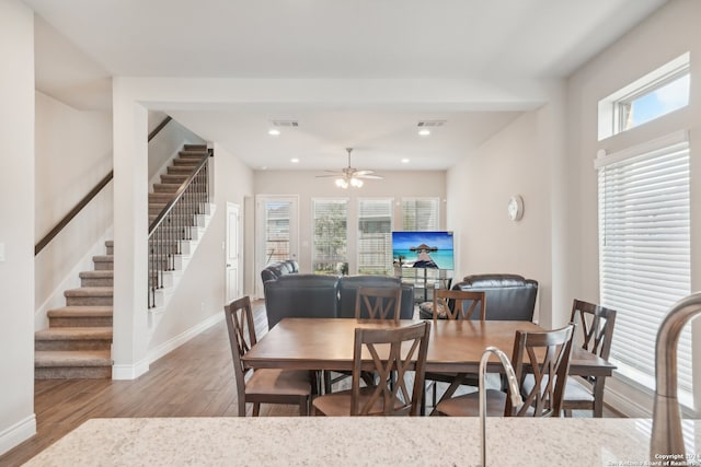 dining space with plenty of natural light, light wood-type flooring, and ceiling fan