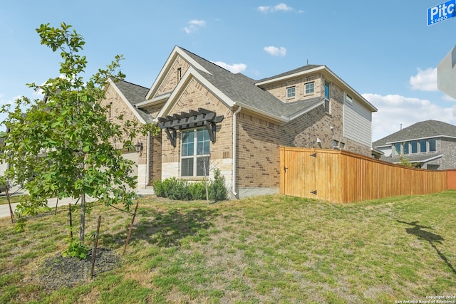 view of home's exterior with a lawn