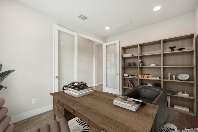 office space with french doors and dark hardwood / wood-style flooring