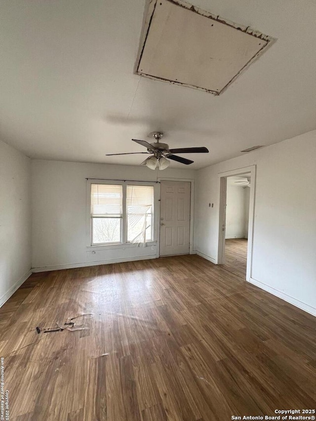 spare room with ceiling fan and wood-type flooring