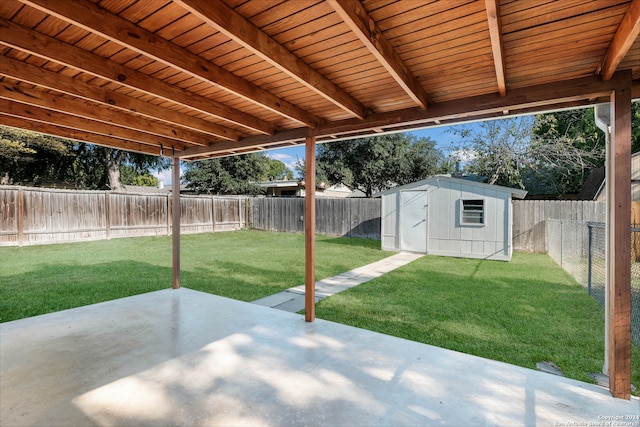 view of patio / terrace with a shed