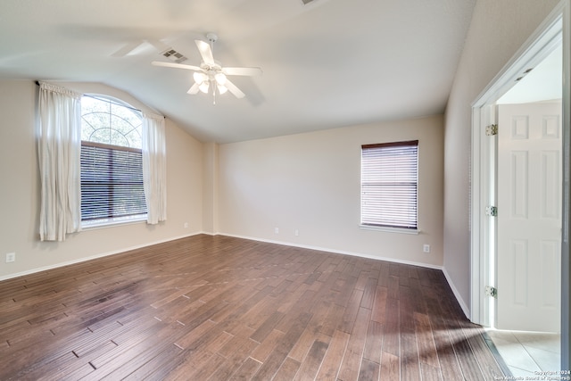 unfurnished room featuring lofted ceiling, ceiling fan, and dark hardwood / wood-style floors