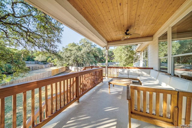 wooden deck featuring ceiling fan and an outdoor hangout area