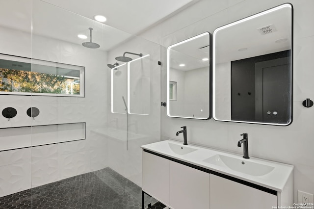 bathroom with walk in shower and vanity