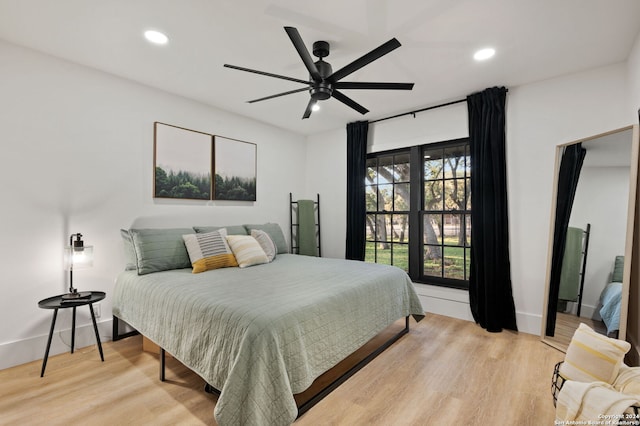 bedroom featuring hardwood / wood-style floors and ceiling fan