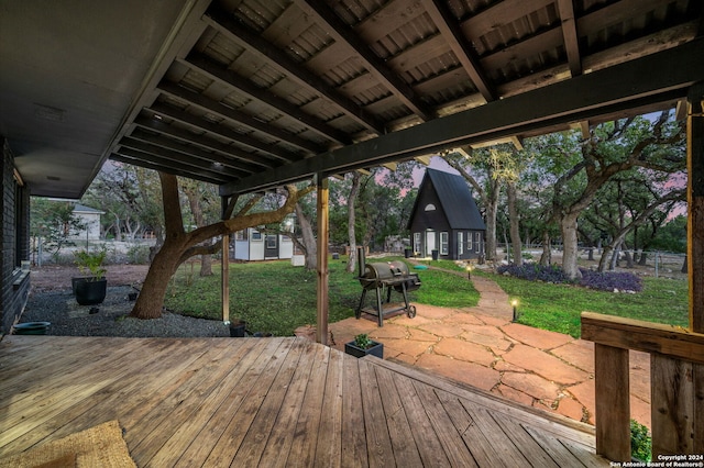 deck featuring a lawn and a patio