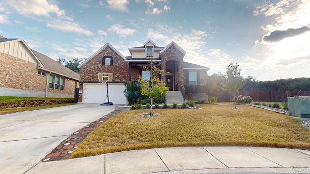 front facade with a garage and a front yard