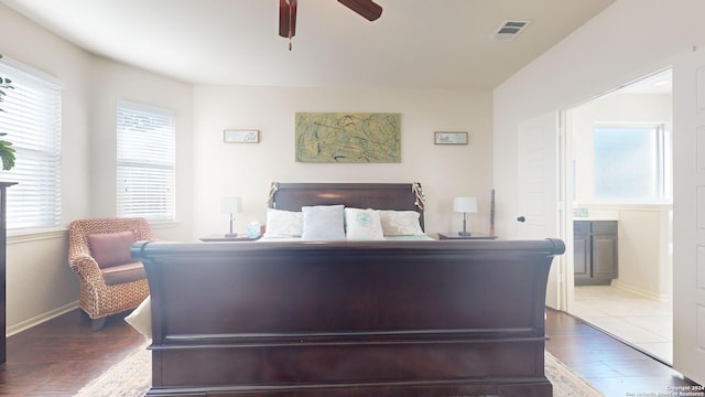 bedroom with hardwood / wood-style flooring and ceiling fan