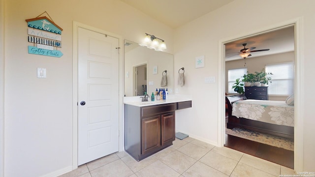 bathroom featuring tile patterned floors, ceiling fan, and vanity