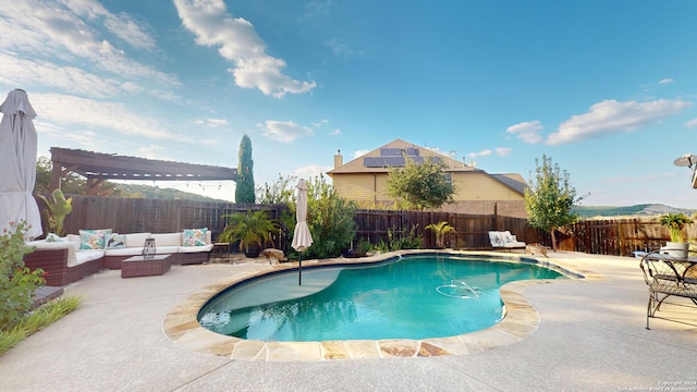 view of swimming pool with an outdoor living space and a patio