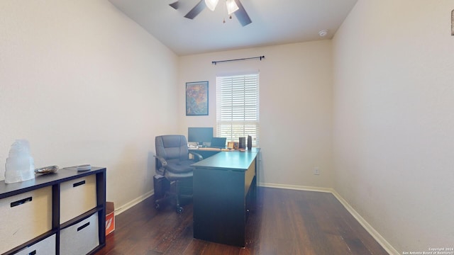 office space featuring dark hardwood / wood-style floors, vaulted ceiling, and ceiling fan