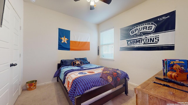 carpeted bedroom with ceiling fan