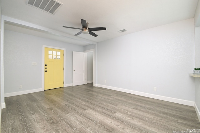 empty room featuring ceiling fan and hardwood / wood-style floors