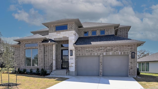 view of front facade with a garage, brick siding, concrete driveway, roof with shingles, and a front yard