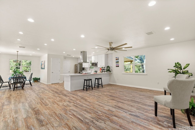 interior space with light hardwood / wood-style floors and ceiling fan