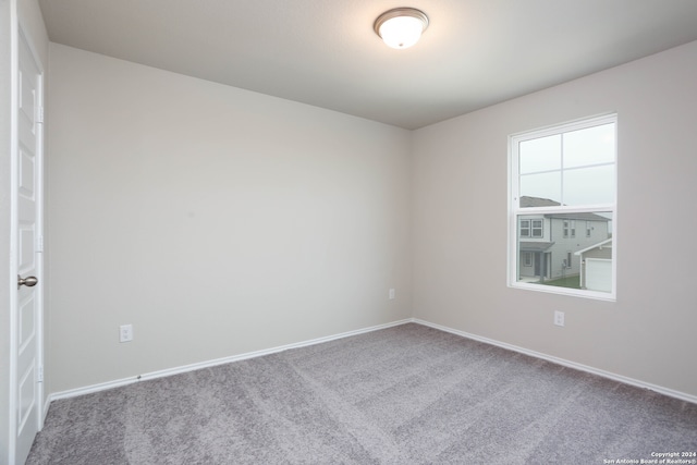 empty room with carpet flooring