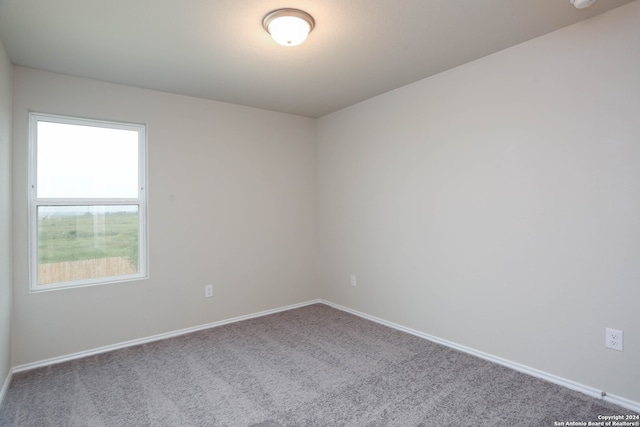 empty room featuring carpet flooring