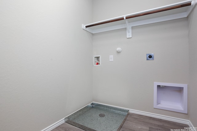 washroom with gas dryer hookup, hookup for a washing machine, dark hardwood / wood-style flooring, and electric dryer hookup