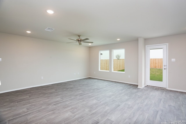 unfurnished room with ceiling fan and light hardwood / wood-style flooring