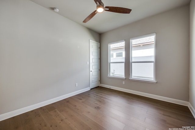 unfurnished room with wood-type flooring and ceiling fan