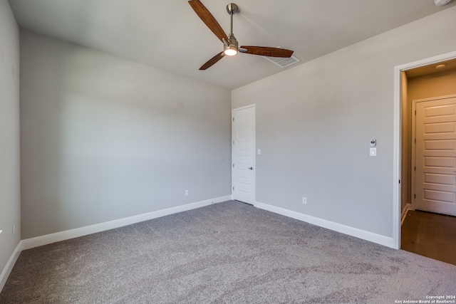 unfurnished room with ceiling fan, carpet flooring, and vaulted ceiling